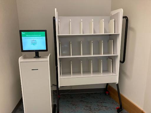 An image of a SmartShelf setup, showing the shelves, monitor, and cabinet